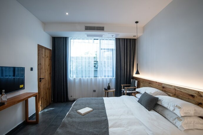 Imagen de la habitación del Hotel Bahaobieyuan. Foto 10