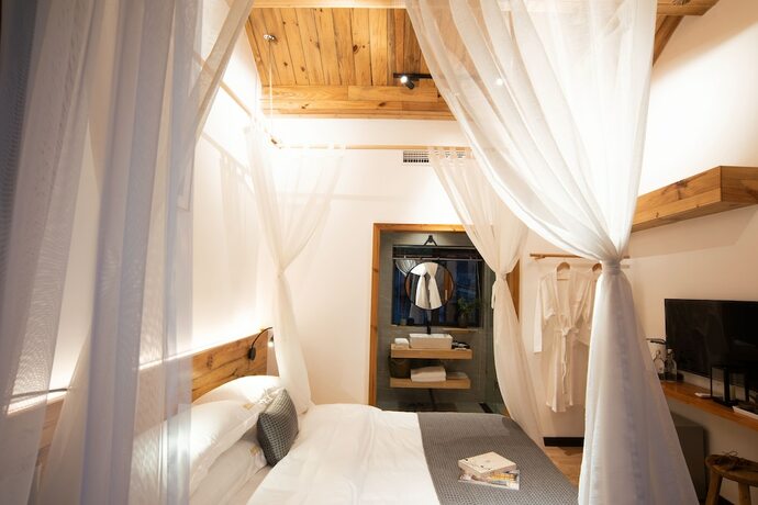 Imagen de la habitación del Hotel Bahaobieyuan. Foto 14