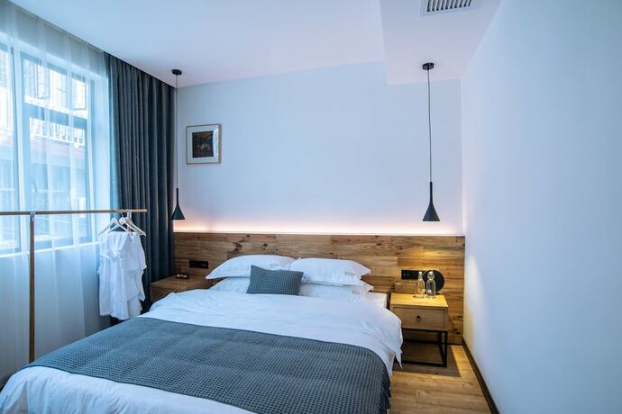 Imagen de la habitación del Hotel Bahaobieyuan. Foto 15