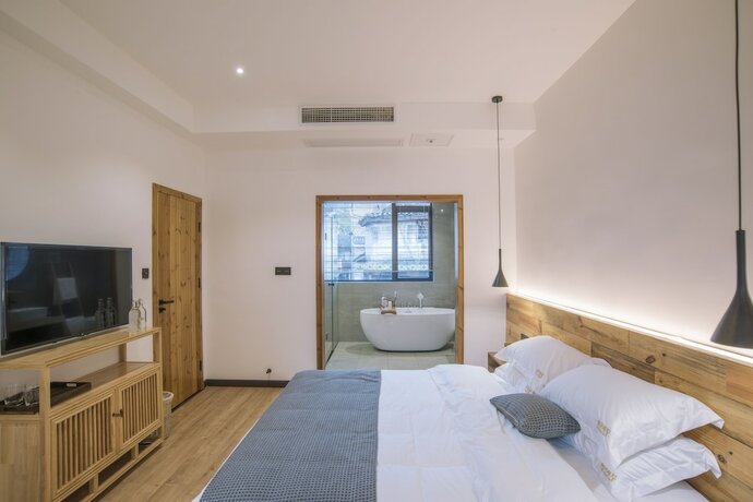 Imagen de la habitación del Hotel Bahaobieyuan. Foto 18