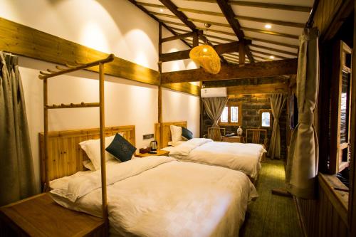 Imagen de la habitación del Hotel Bai He Vacation Guesthouse. Foto 6