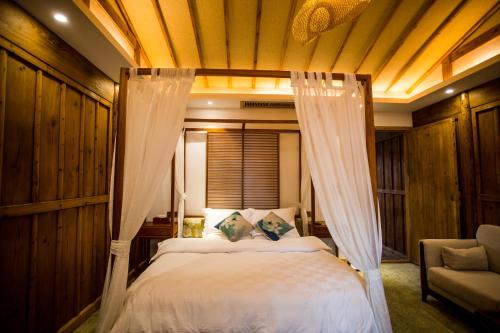 Imagen de la habitación del Hotel Bai He Vacation Guesthouse. Foto 8