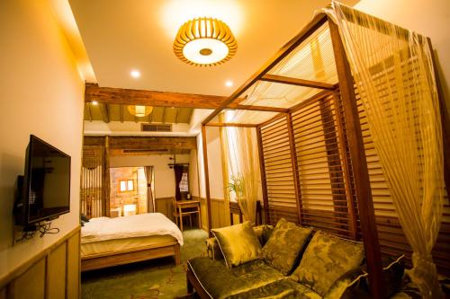 Imagen de la habitación del Hotel Bai He Vacation Guesthouse. Foto 9