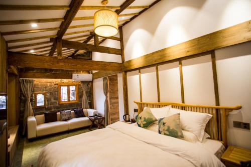 Imagen de la habitación del Hotel Bai He Vacation Guesthouse. Foto 10