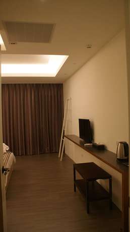 Imagen de la habitación del Hotel Bai Ji Yi. Foto 13