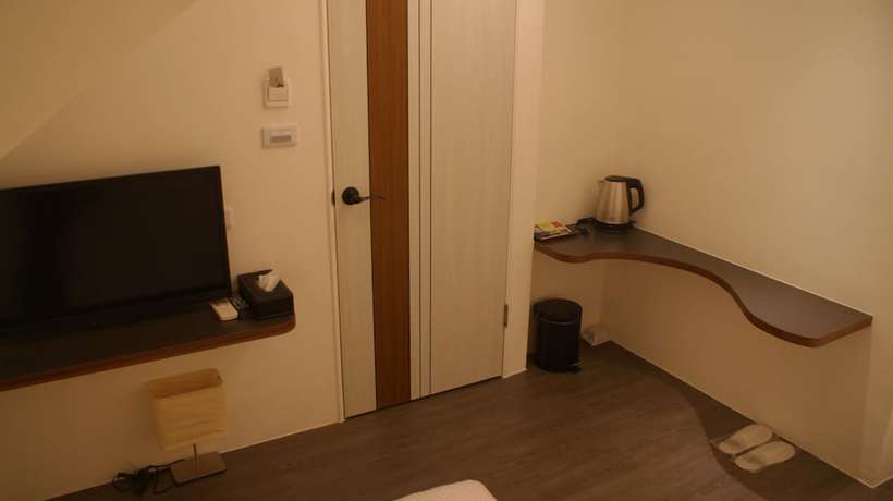 Imagen de la habitación del Hotel Bai Ji Yi. Foto 14