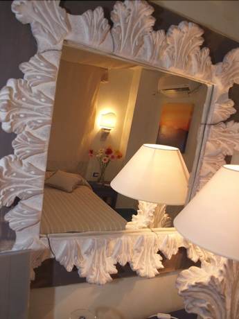 Imagen de la habitación del Hotel Baia Dei Faraglioni. Foto 2