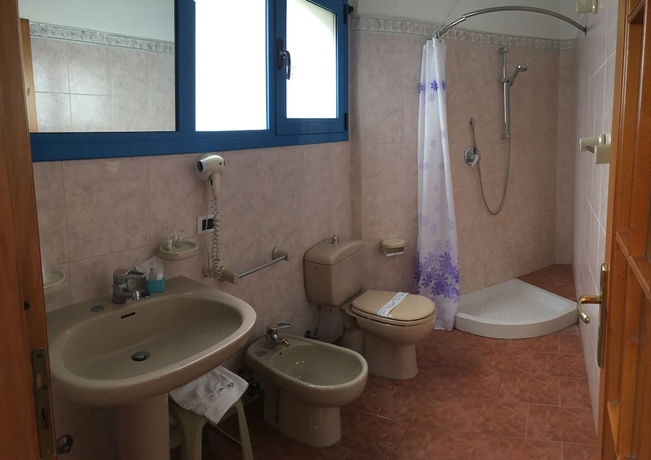 Imagen de la habitación del Hotel Baia Di Naxos. Foto 19