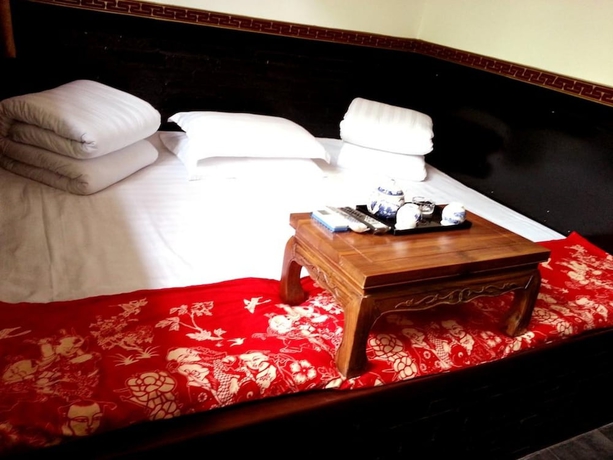 Imagen de la habitación del Hotel Baichanghong Inn. Foto 15