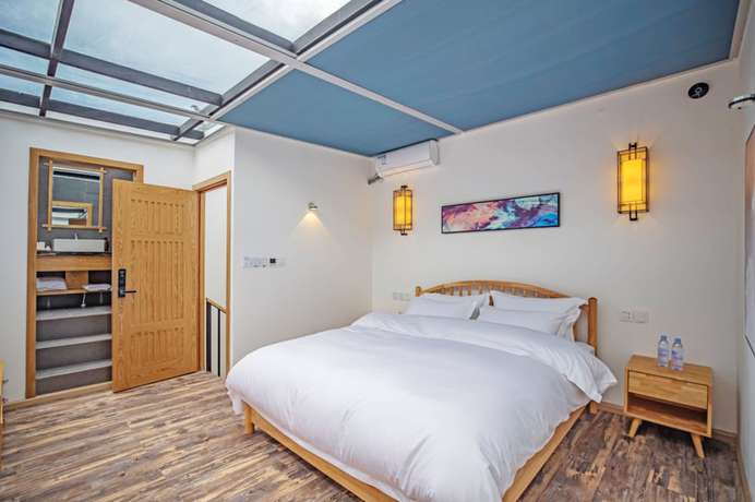 Imagen de la habitación del Hotel Baiduju. Foto 13