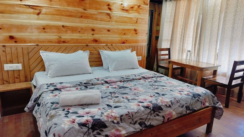 Imagen de la habitación del Hotel Baikunth Home Stays. Foto 15