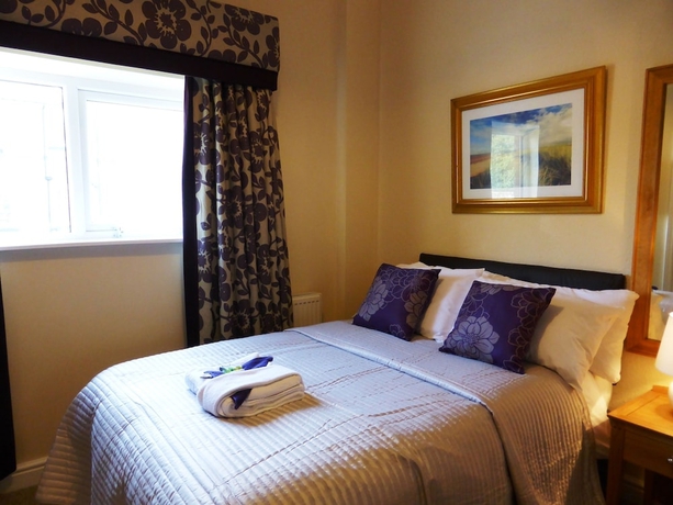 Imagen de la habitación del Hotel Bailey Ground Lodge. Foto 15