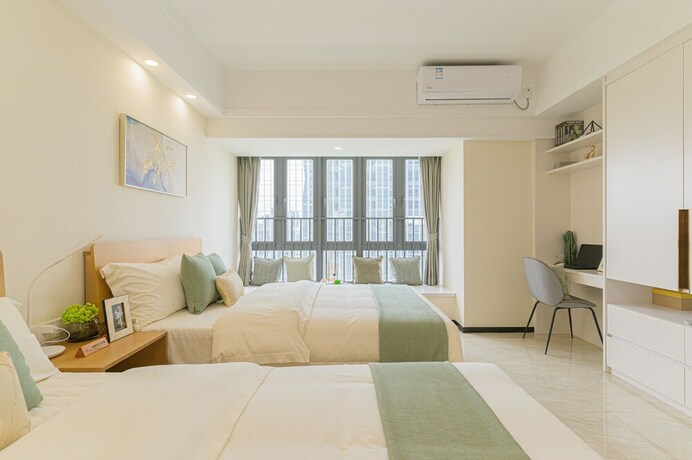 Imagen general del Hotel Bainianhui International Apartment. Foto 11