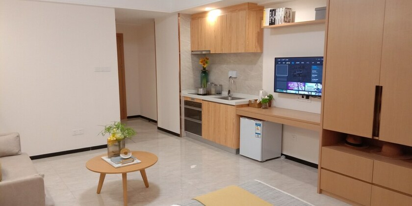 Imagen de la habitación del Hotel Bainianhui International Apartment. Foto 23