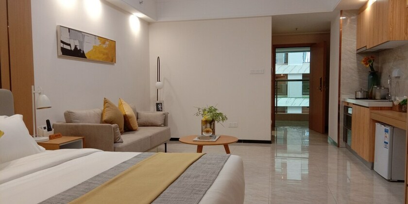 Imagen de la habitación del Hotel Bainianhui International Apartment. Foto 24