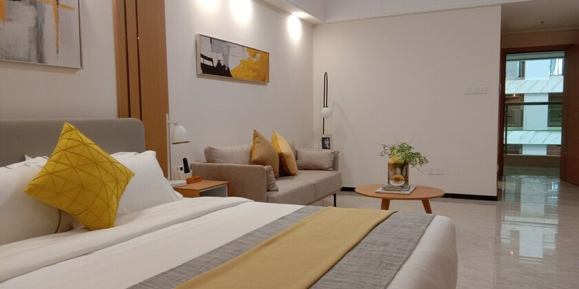Imagen de la habitación del Hotel Bainianhui International Apartment. Foto 25
