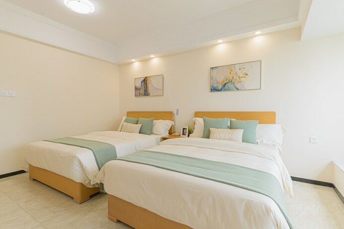 Imagen de la habitación del Hotel Bainianhui International Apartment. Foto 28