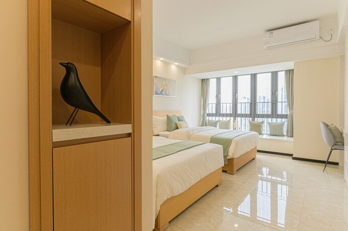 Imagen de la habitación del Hotel Bainianhui International Apartment. Foto 29
