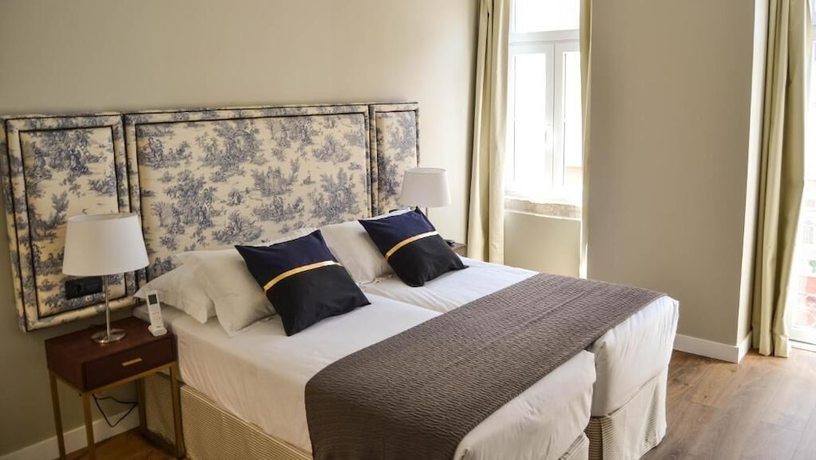 Imagen de la habitación del Hotel Bairro Alto Suites. Foto 13