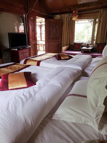 Imagen de la habitación del Hotel Baisha Holiday Resort Lijiang. Foto 5