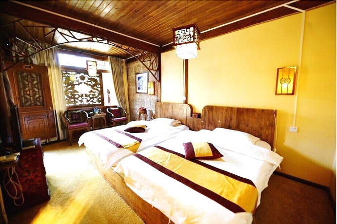 Imagen de la habitación del Hotel Baisha Holiday Resort Lijiang. Foto 12