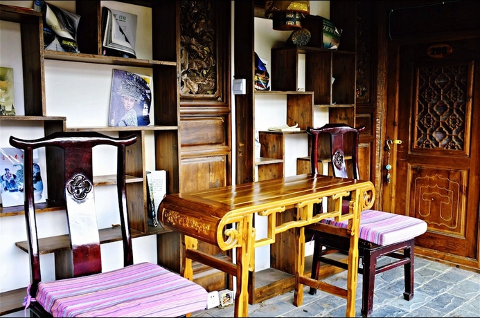 Imagen de la habitación del Hotel Baisha Holiday Resort Lijiang. Foto 15