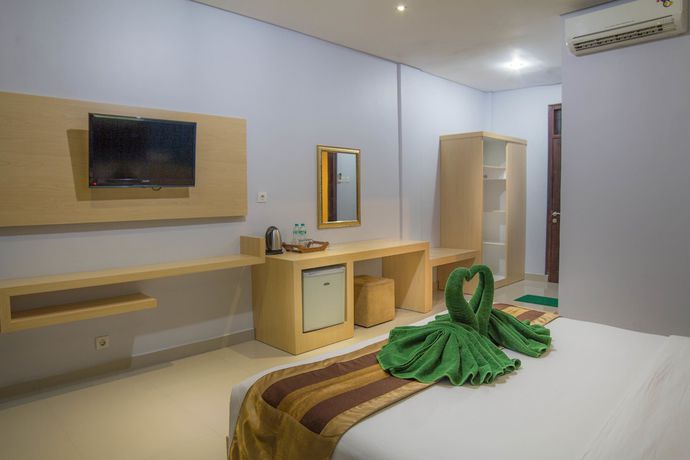 Imagen de la habitación del Hotel Bakung Beach Resort. Foto 5