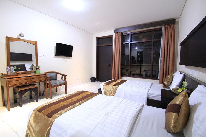 Imagen de la habitación del Hotel Bakung Beach Resort. Foto 8