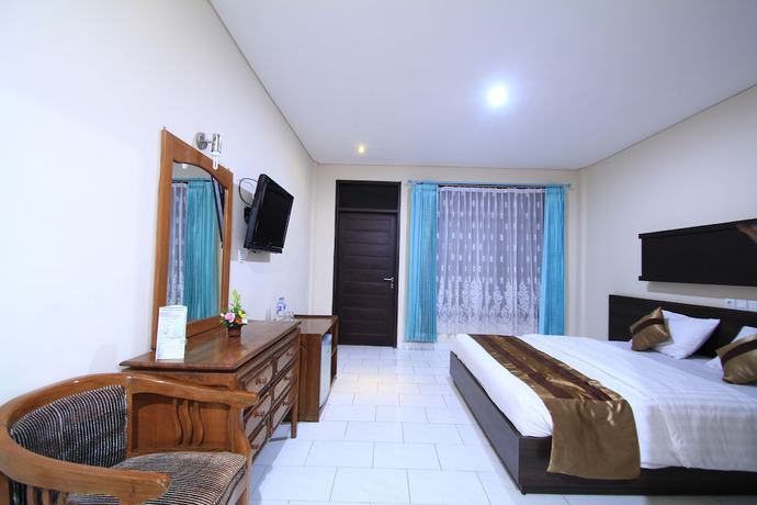 Imagen de la habitación del Hotel Bakung Beach Resort. Foto 11