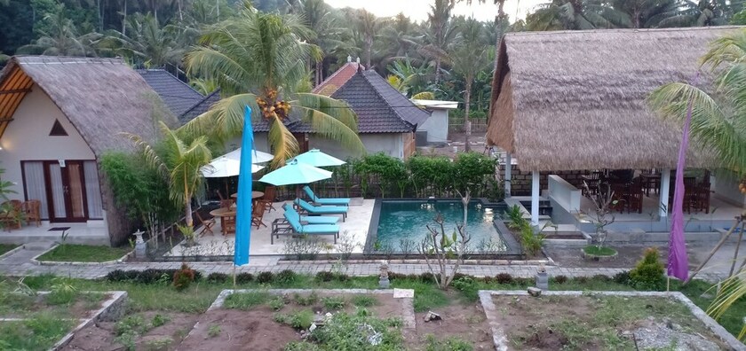 Imagen de los exteriores del Hotel Bale Lumbung Bungalows. Foto 34