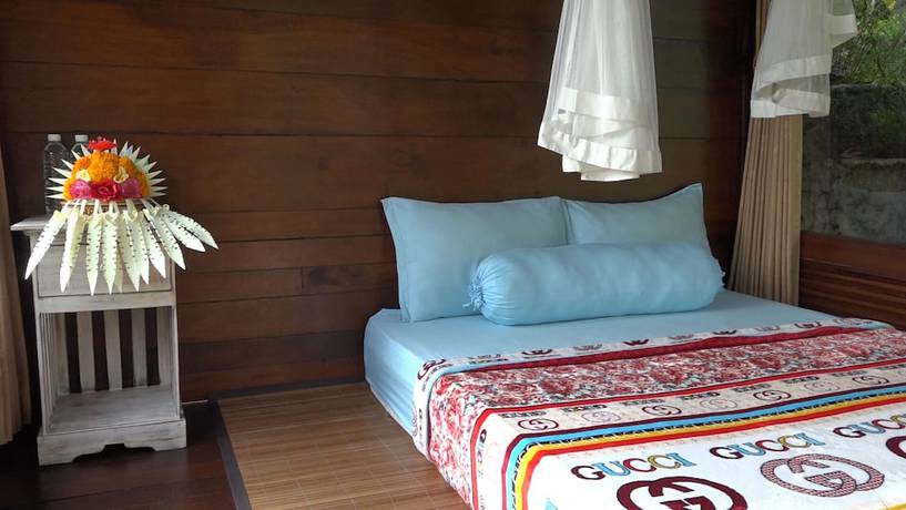 Imagen de la habitación del Hotel Bali Jungle Huts. Foto 10