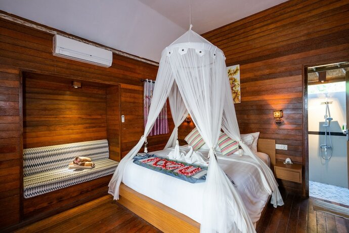Imagen de la habitación del Hotel Bali Nusa Cottage. Foto 19