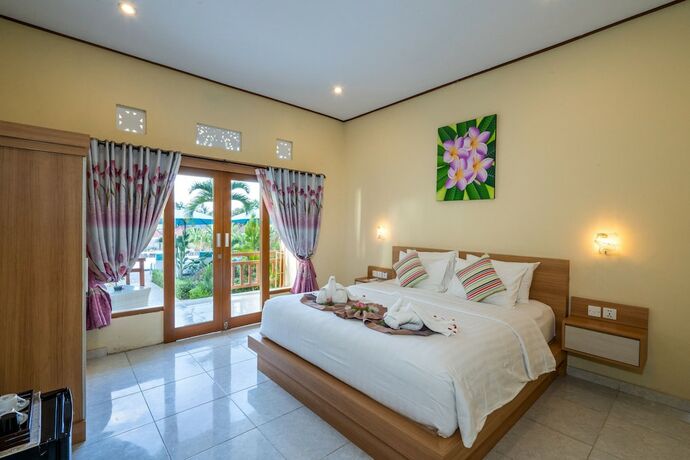 Imagen de la habitación del Hotel Bali Nusa Cottage. Foto 22