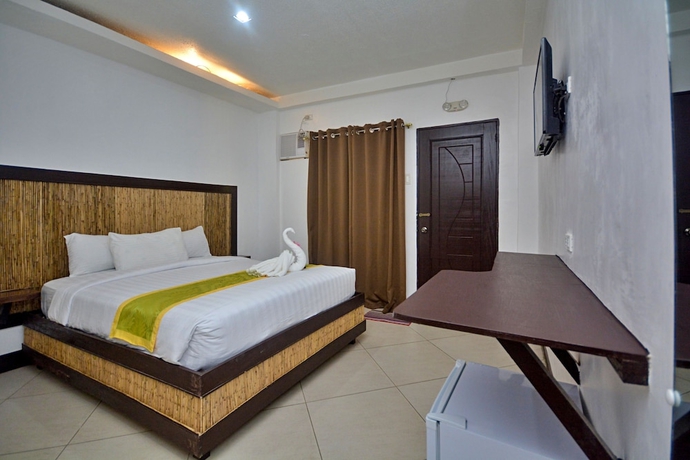 Imagen de la habitación del Hotel Bamboo Beach Resort. Foto 7