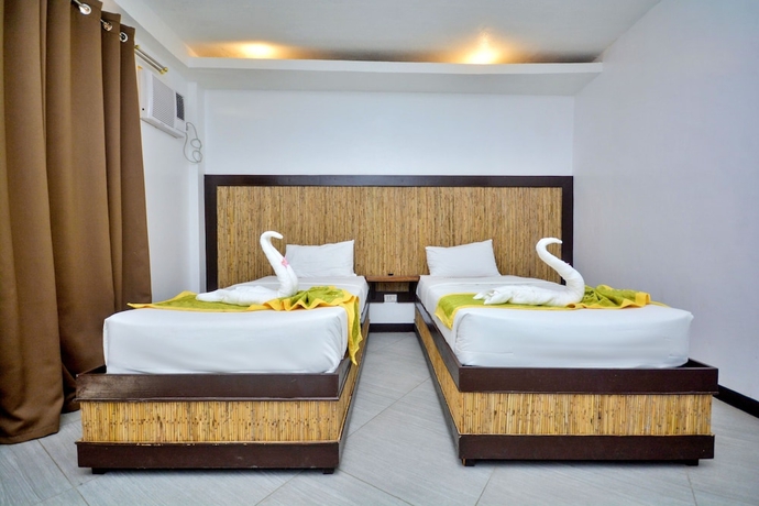 Imagen de la habitación del Hotel Bamboo Beach Resort. Foto 9