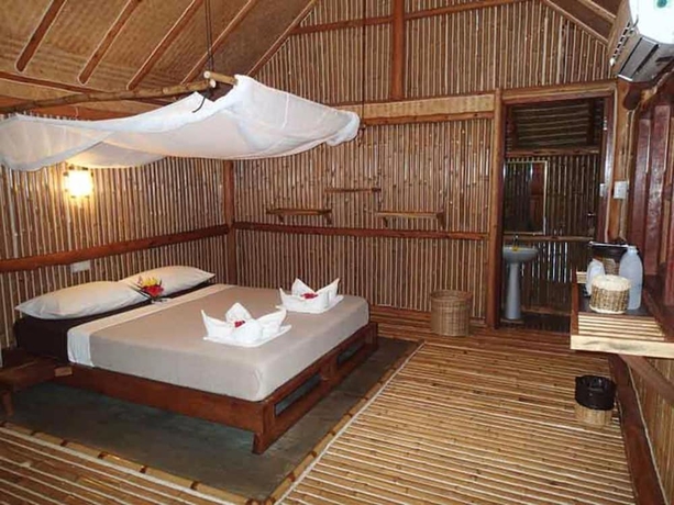 Imagen de la habitación del Hotel Bamboo Hideaway Resort. Foto 12