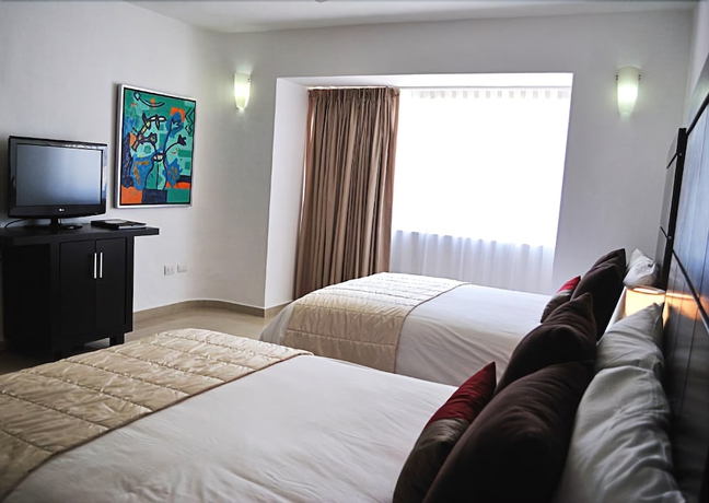 Imagen de la habitación del Hotel Bambu Suites - Near Quinta Avenida. Foto 11
