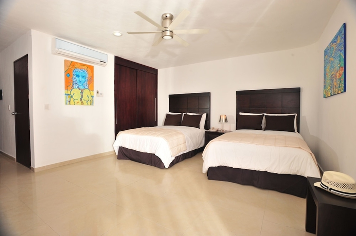 Imagen de la habitación del Hotel Bambu Suites - Near Quinta Avenida. Foto 12