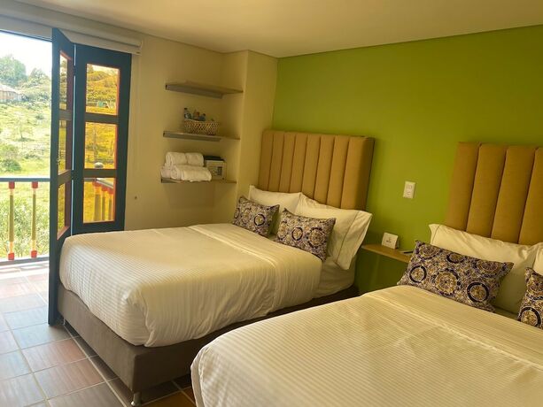 Imagen de la habitación del Hotel Bamb&uacute; Guatap&eacute;. Foto 19