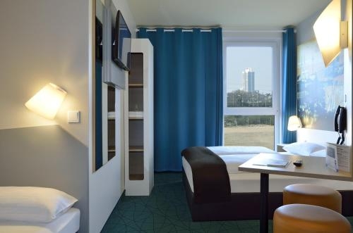 Imagen de la habitación del Hotel B&B Köln-messe. Foto 8