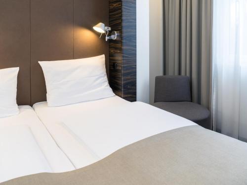 Imagen de la habitación del Hotel B&B München-Putzbrunn. Foto 8