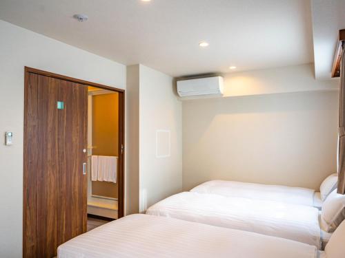 Imagen de la habitación del Hotel Bande Hotel Tenpozan Higashi. Foto 7