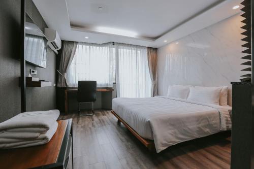Imagen de la habitación del Hotel Bangkok City Link Hotel. Foto 5