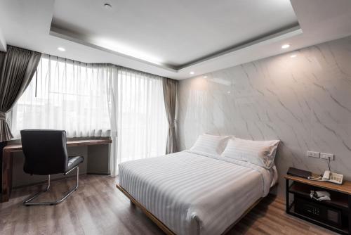 Imagen de la habitación del Hotel Bangkok City Link Hotel. Foto 7