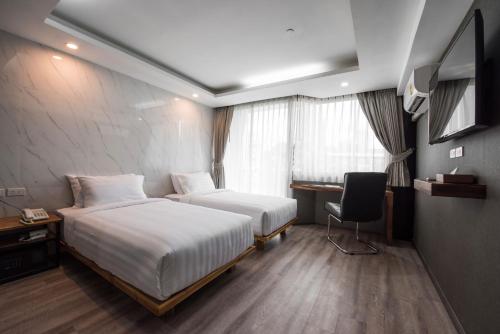 Imagen de la habitación del Hotel Bangkok City Link Hotel. Foto 8