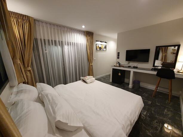 Imagen de la habitación del Hotel Bannjamjuree Resort Sattahip. Foto 18