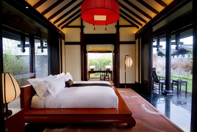 Imagen de la habitación del Hotel Banyan Tree Lijiang. Foto 6