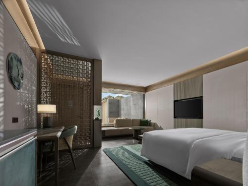Imagen de la habitación del Hotel Banyan Tree Suzhou Shishan. Foto 7
