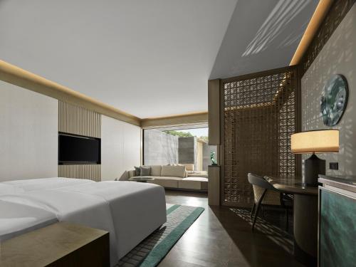 Imagen de la habitación del Hotel Banyan Tree Suzhou Shishan. Foto 13