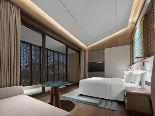 Imagen de la habitación del Hotel Banyan Tree Suzhou Shishan. Foto 16